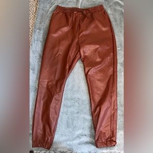 Size Medium, Brand is Saints, color is like a brassy-orange